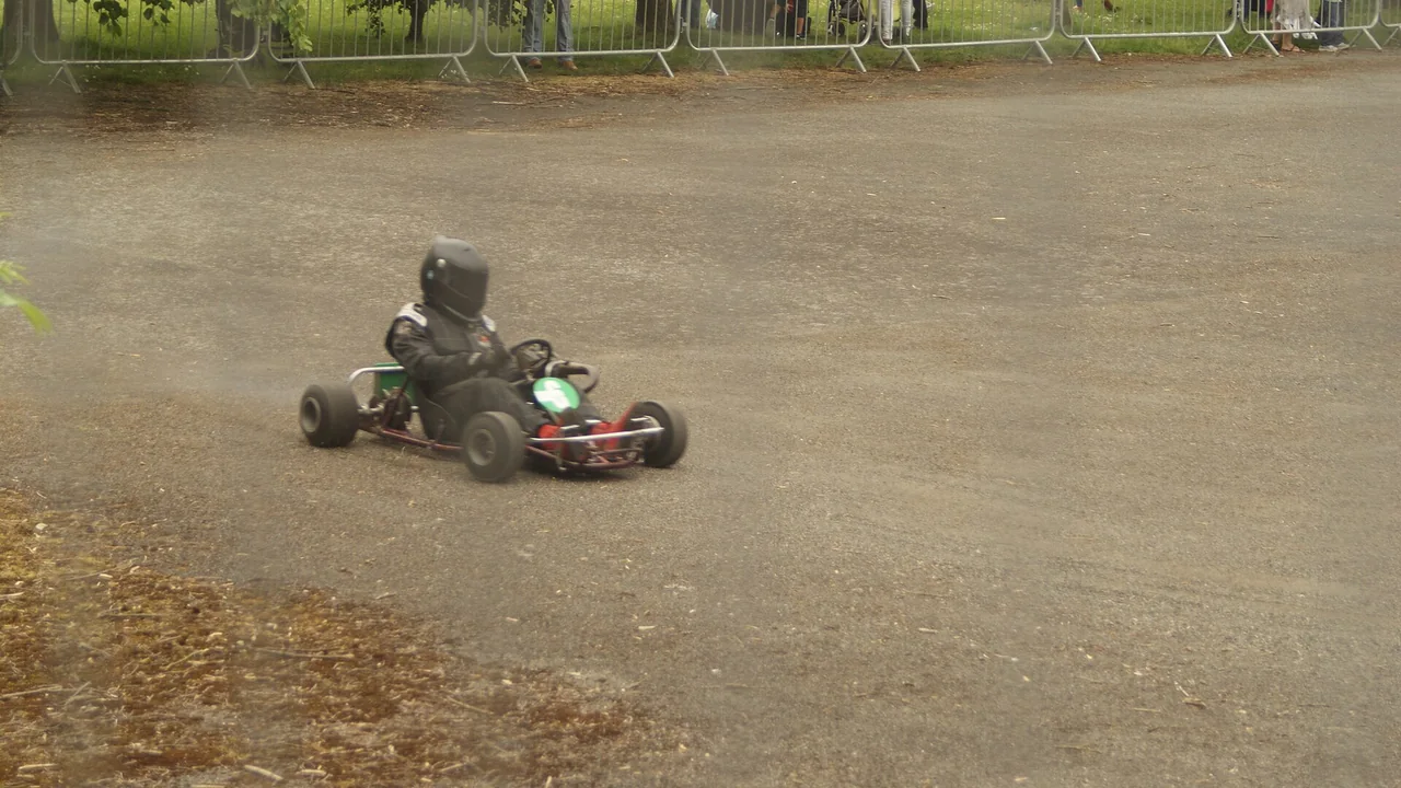 View of a go-kart racing around the makeshift track at National Sports Centre — cover image for Mario Kart World Update Adds Ten SNES-Inspired Courses