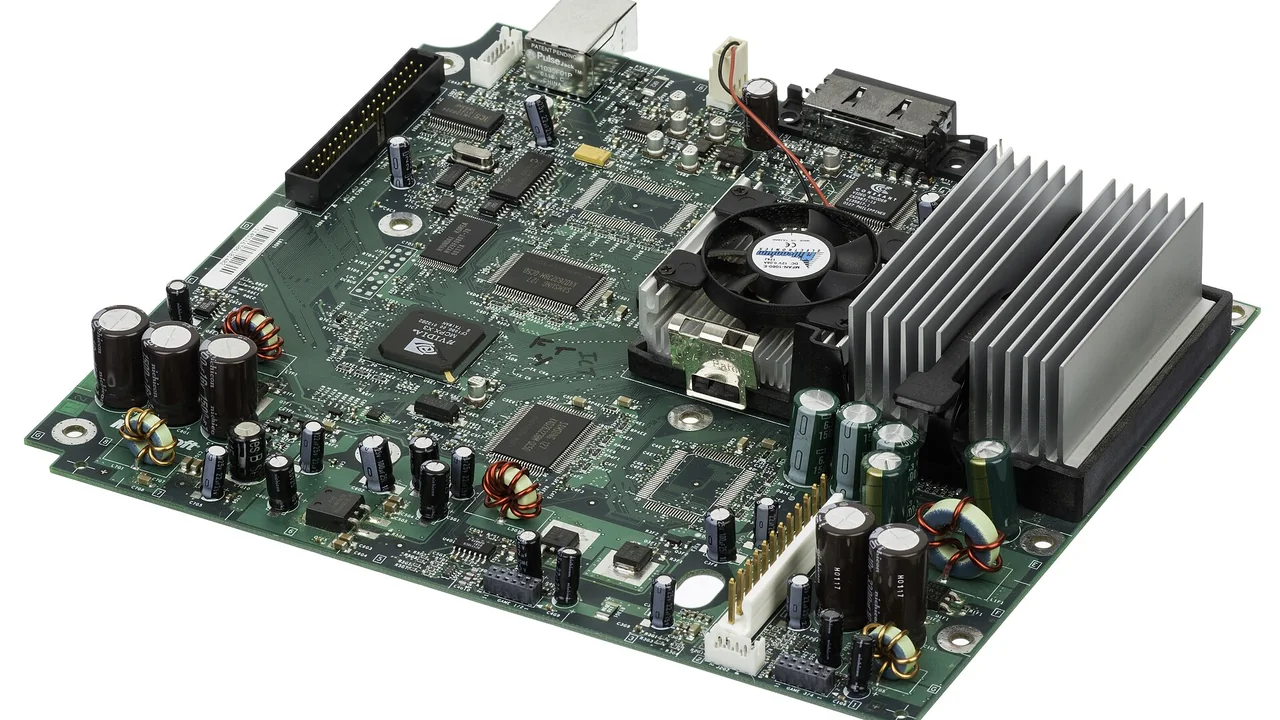 The motherboard for the Xbox, a sixth-generation gaming console made by Microsoft that was first released in 2001. The Xbox was Microsoft's first foray into the gaming console market, and was followed by the Xbox 360 in 2005. The console is notable for having a built-in hard drive, breakaway controller dongles and an Ethernet port to support Microsoft's online gaming service, Xbox Live. The motherboard for the Xbox contains a custom 32-bit, 733 MHz Intel Pentium III CPU. It has 64 MB of DDR memory and a 233 MHz Nvidia GPU. — cover image for Project Helix: Xbox Says Its Next Console Will Play Xbox and PC Games