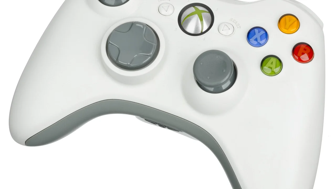 The standard white wireless controller for the Xbox 360 gaming system. The controller runs off two AA batteries or a rechargeable battery pack. It features a communications port on the bottom of the controller for attaching a headset or keyboard to. — cover image for Xbox Games Showcase 2026: Gears, Halo, Fable and Anniversary Hardware