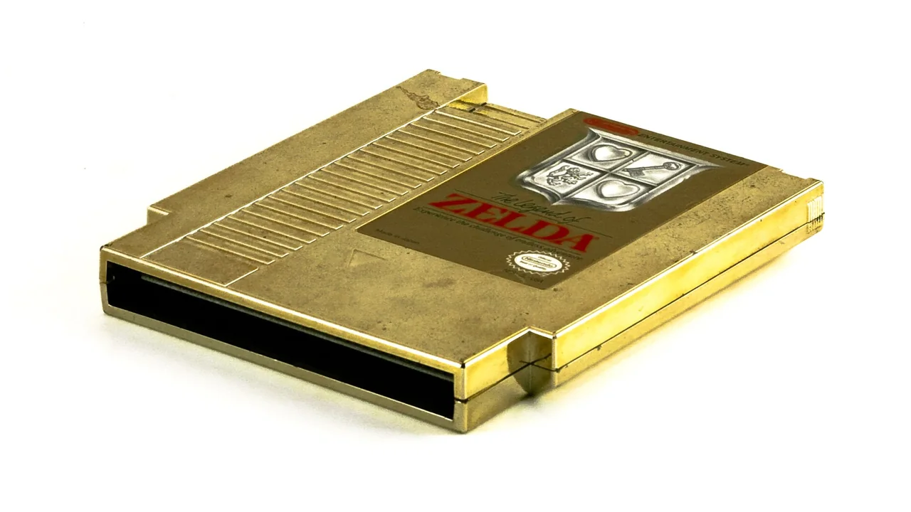 Golden "The Legend of Zelda" NES cartridge. Light box with Vivitar 285-HV 1/4 from the right. — cover image for Nintendo Outlines The Legend of Zelda’s 40th Anniversary Plans